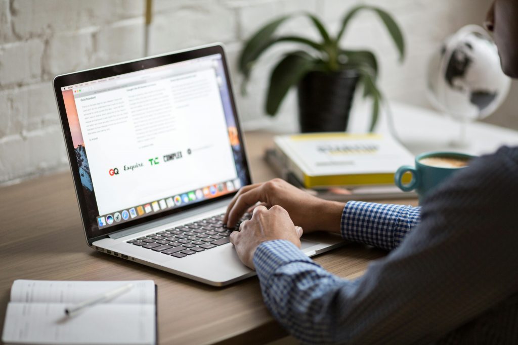 person sitting with his laptop